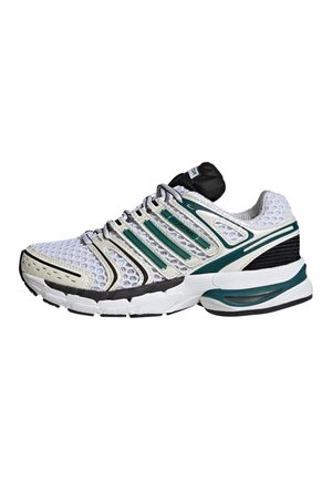Zapatilla deportiva blanca y verde con parte superior de malla, suela negra y verde, diseño con cordones y detalles de marca en el lateral y la lengüeta.