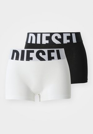 Deux paires de boxers : une noire avec une ceinture de logo blanche, une blanche avec une ceinture de logo noire. Tissu doux et élastique, design ajusté.