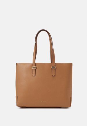 Braune Leder-Handtasche mit zwei Schulterriemen und goldenen Schnallendetails, mit "ANNA FIELD" Logo in der Mitte vorne.