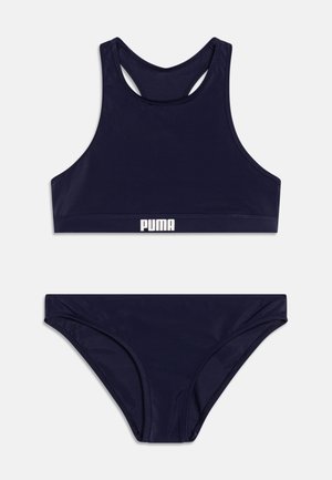 Námornícky modrý bikiny set pozostávajúci z topu s vysokým golierom a nízkymi nohavicami, s hladkým povrchom a bielym logom "PUMA" na pásu.