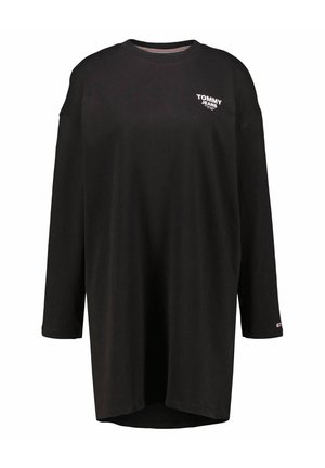 Camiseta negra de manga larga hecha de algodón. Presenta un cuello redondo, un corte holgado y un pequeño logo blanco en el pecho izquierdo. El dobladillo es ligeramente curvado.