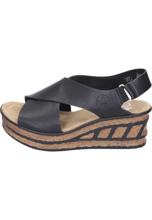 Sorte læder kilehælssandaler med krydsremdesign, mellemsål i kork og tekstureret sort gummiydersål. Justerbar rem ved hælen for pasform.