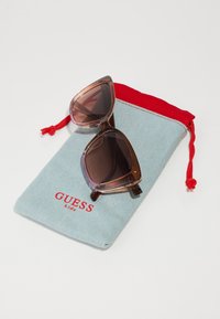 Guess UNISEX beżowy