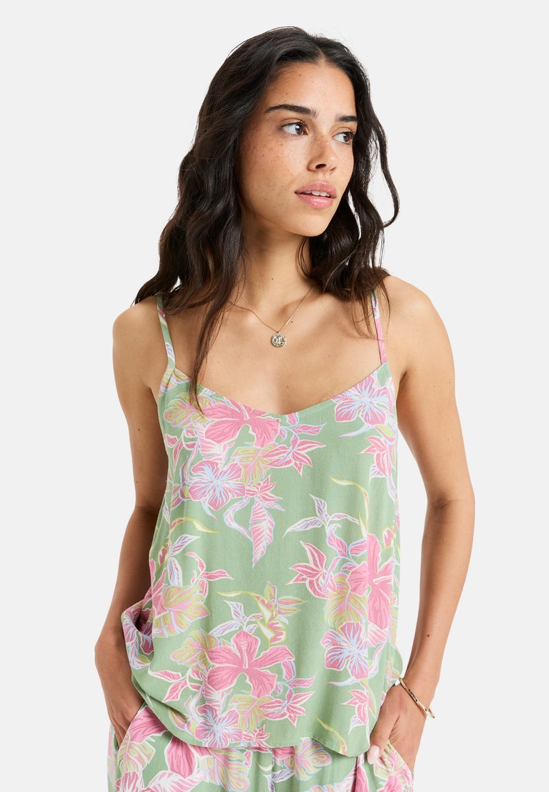 Light green floral tank top featuring pink and white tropical flower patterns, thin straps, and a relaxed fit with side pockets.