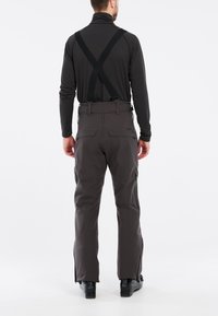 Graue Skihosen mit verstellbaren schwarzen Trägern, seitlichen Taschen mit Reißverschluss und schmal zulaufenden Beinen, entworfen für Funktionalität bei kaltem Wetter.