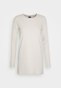 Bluzka z długim rękawem w jasnobeżowym kolorze, wykonana z prążkowanej tkaniny. Posiada okrągły dekolt i lekko luźny krój, z gładką fakturą i minimalistycznym wzornictwem.