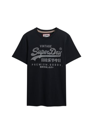 Czarna bawełniana koszulka z krótkim rękawem, z szarym nadrukiem logo, które brzmi "Vintage SuperDry" z akcentami i tekstem w kilku językach.