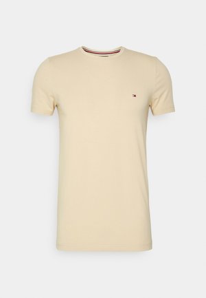Herrenbeige Kurzarm T-Shirt mit Rundhalsausschnitt und kleinem Tommy Hilfiger Logo auf der linken Brust.