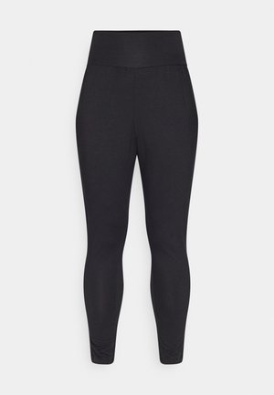 Sorte leggins med høy midje, med en jevn tekstur og en tettsittende design, som smalner inn ved ankelen med subtil rynkedetalj.