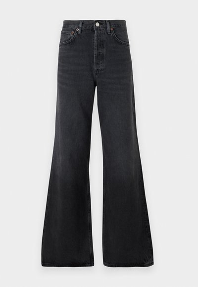 Black flared jeans made of denim, featuring a high waist, front pockets, and a button closure with metal hardware. Smooth texture overall.