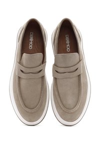 Light beige suede slip-on shoes with a rounded toe, elastic accent strap, and white rubber sole. Smooth texture with minimal stitching details.