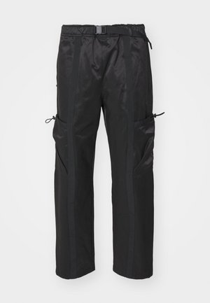Black cargo pants made of lightweight material, featuring adjustable drawstrings, side pockets, and contrasting vertical stripes.