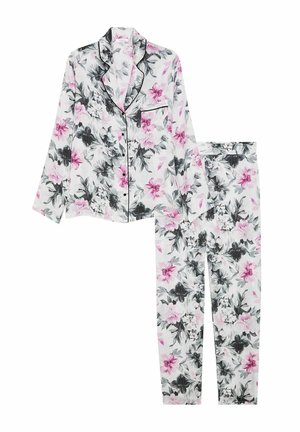 Set de pijama floral compus dintr-o bluză cu buton și mâneci lungi, împreună cu pantaloni asortați. Materialul este alb, cu un model floral roz și negru.