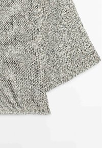 Close-up of gray and white marled knit fabric with wide ribbed cuffs on a long-sleeve garment, displayed on white background.