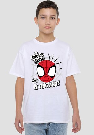 White short-sleeve T-shirt featuring a red Spider-Man face graphic with white eyes, black text, and web design elements. Casual fit.