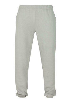 Gaiši pelēkas sporta bikses ar elastīgu vidukli un potīšu aprocēm, ar sānu kabatām un brīvu piegriezumu.