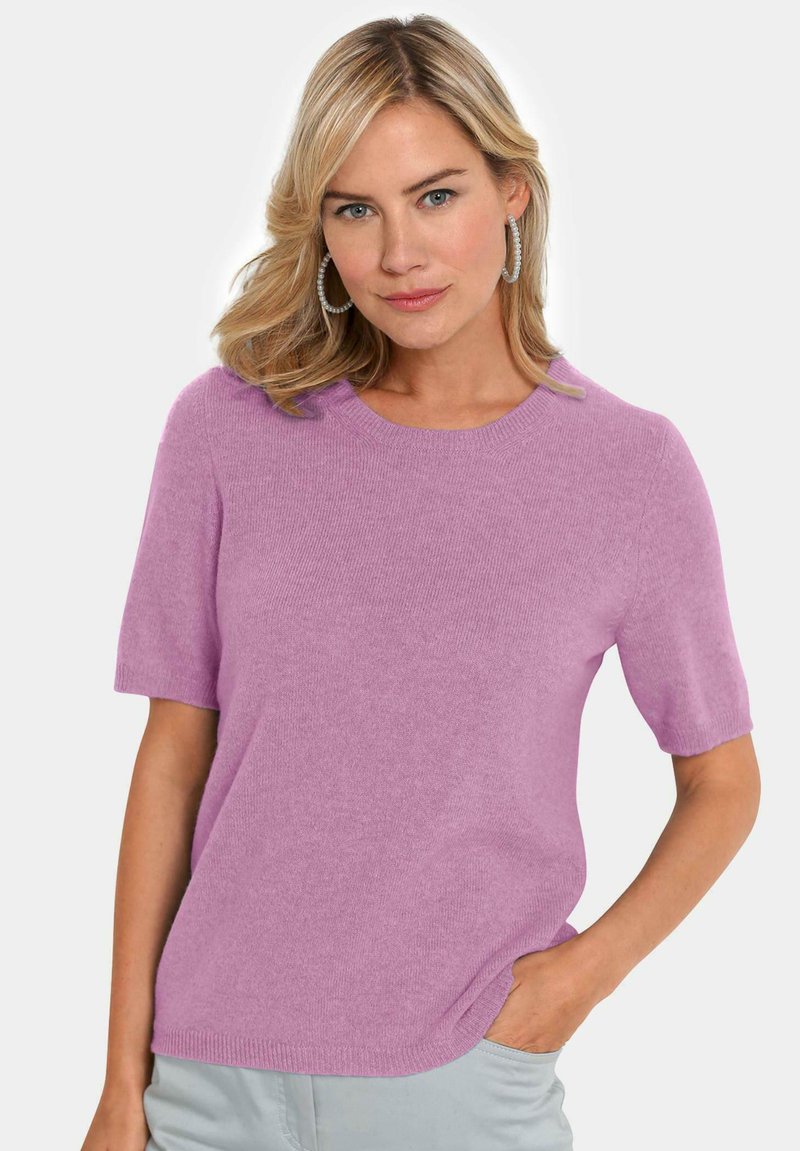 Helles rosa kurzärmliges Sweater mit rundem Halsausschnitt, hergestellt aus weichem Strickmaterial. Verfügt über eine lockere Passform und gerippte Säumendetails.