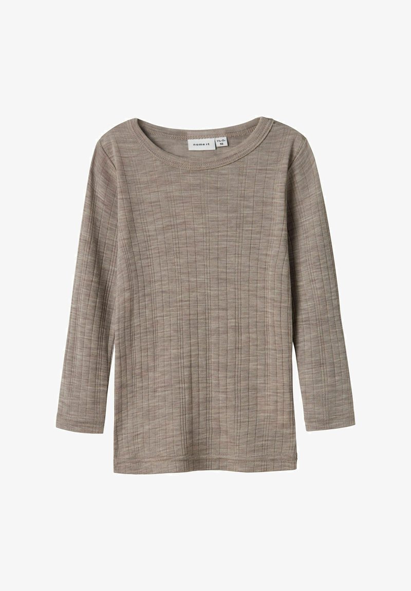 Langärmliges Oberteil aus beigem Rippstoff. Mit Rundhalsausschnitt und geradem Schnitt. Weicher Stoff mit auffälligen vertikalen Linien.