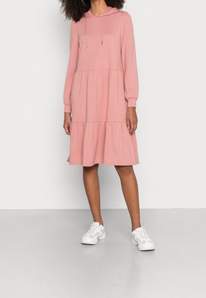 Lyserød hoodie-kjole med lange ærmer og en udskåret, lagdelt bund. Fremstillet af blødt stof og har snoretræk og elastiske manchetter.