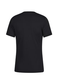 T-shirt nera a maniche corte realizzata in un tessuto morbido e liscio. Presenta un collo rotondo e un design semplice e pulito. Nessun marchio o motivo visibile.