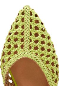 Woven open-toe shoe with a pointed shape, featuring bright green synthetic material, intricate braiding pattern, and a tan sole.