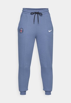 Blå joggebukser i bomullsmiks med elastisk midje, svart snor, sidelommer, ribbede mansjetter, med Paris-logo og Nike-swoosh.