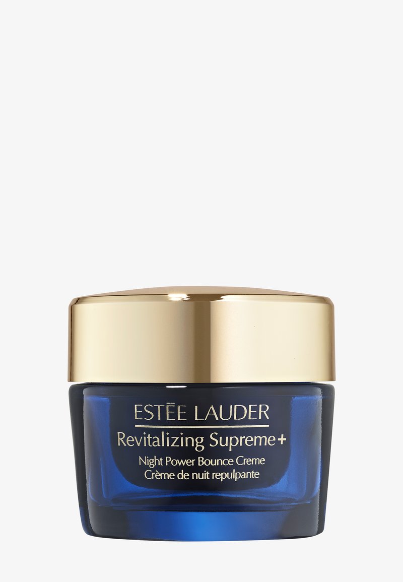 Blå glasbeholder med et guld låg, mærket "Estée Lauder Revitalizing Supreme+ Night Power Bounce Crème," med en glat, poleret finish.