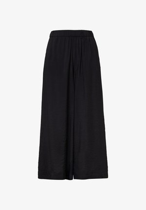 Pantalons noirs à jambes larges avec une taille élastique, fabriqués en tissu léger et texturé, présentant de légères plis pour ajouter de la dimension.