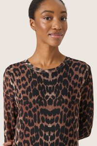 Top con stampa leopardata, colletto rotondo, maniche lunghe e una palette di colori nera e marrone elegante; texture liscia e leggera lucentezza.