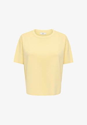 T-shirt jaune clair à manches courtes avec col rond, coupe décontractée et encolure côtelée sur un fond blanc.