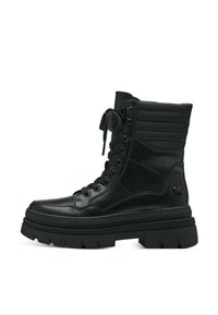 Bottines noires en cuir avec une semelle épaisse, un laçage à l'avant, un col rembourré et des détails texturés sur les côtés.