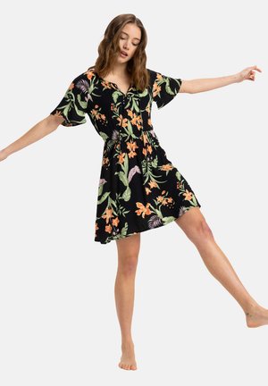 Floral dress featuring a black background with orange and green patterns, short sleeves, tie-front design, and a flared hem.