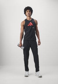 adidas Performance ALL GYM CATEGORY GRAPHIC - Topper - black