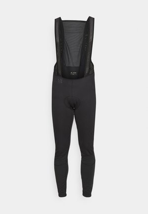 Black cycling bib shorts with mesh adjustable straps, padded insert, tight-fit legs, and reflective details for visibility.