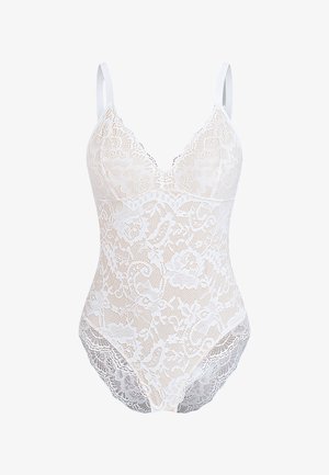 White lace bodysuit with deep V-neck, thin straps, intricate floral patterns, and scalloped edges along the bottom and neckline.