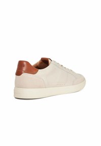 Beige suede sneaker with a smooth tan leather heel and white rubber sole. Features subtle stitching and perforated detailing on the sides.