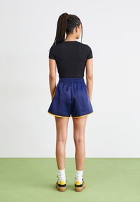 adidas Originals SPRINTER - Šortai - dark blue