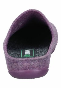 Purple felt slipper with a rounded shape, soft texture, and a rubber sole. Interior features a black insole with a logo label.