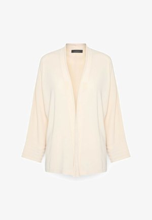 Cardigan ouvert de couleur crème avec manches longues et poignets côtelés, présenté sur un fond blanc.