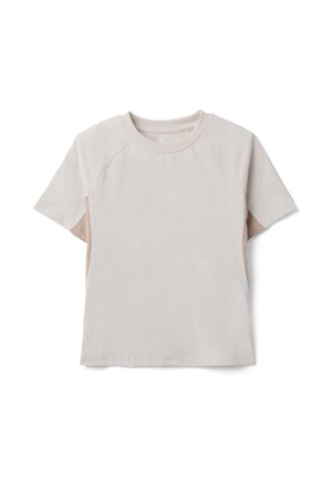 Beige T-Shirt mit Rundhalsausschnitt und kurzen Raglanärmeln, mit dezenten Seitenpaneeldetails, flach auf einem weißen Hintergrund liegend.