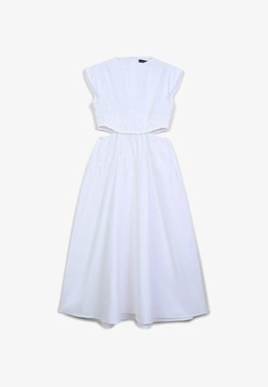 Abito bianco senza maniche con vita ritagliata, collo alto rotondo e gonna lunga e fluente.