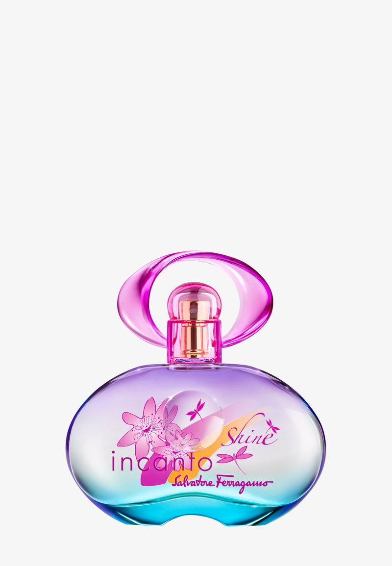 Botella de perfume ovalada con diseño floral rosa, degradado púrpura-rosa y tapón rosa en forma de lazo, etiquetada como "Incanto Shine Salvatore Ferragamo".