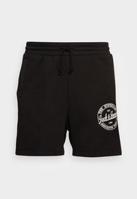 Černé volné šortky s elastickým pasem na šňůrku, postranními kapsami a bílým kruhovým logem "Jack & Jones" na pravé noze.