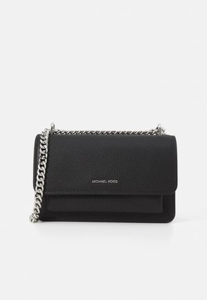 Black leather crossbody bag with a textured finish, silver-tone chain strap, flap closure, and embossed logo on the front.