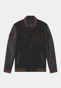 Black varsity jacket with orange accents. Wool body, leather sleeves, ribbed collar and cuffs, featuring embroidered numbers and patches.