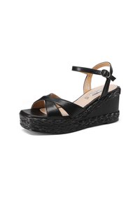 Sandali wedge neri con cinturini in pelle incrociati, cinturino alla caviglia regolabile, dettagli in juta intrecciata sulla piattaforma e finitura liscia.