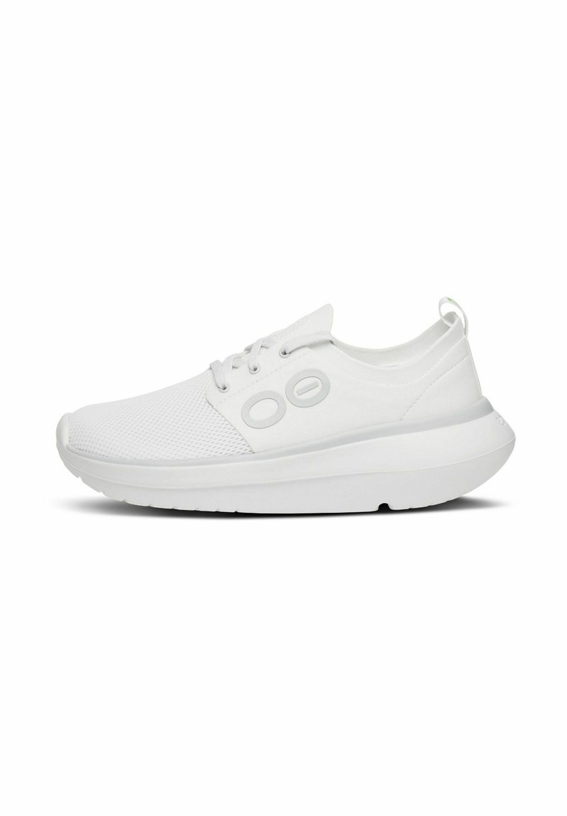 White athletic shoes with a mesh upper, padded collar, and rubber outsole. Features round eyelets and a pull tab at the heel.