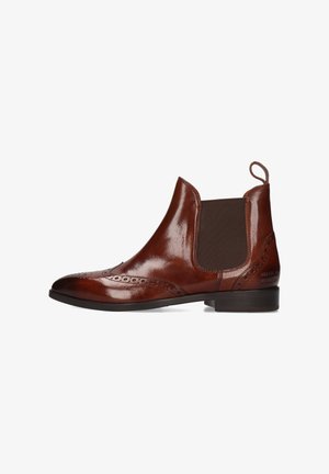 Braune Chelsea-Stiefel aus Leder mit Brogue-Details, elastischen seitlichen Einsätzen und einer Zuglasche. Glatte Textur und leicht spitz zulaufende Zehenpartie. Niedriger Absatz.