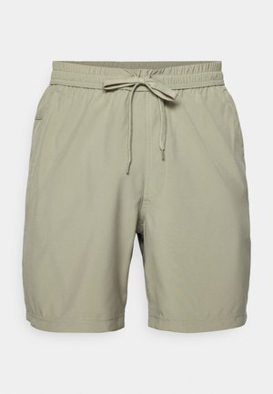 Khaki kopalne hlače s elastičnim pasom in vrvico, z bočnimi žepi in gladkim, lahkim materialom.