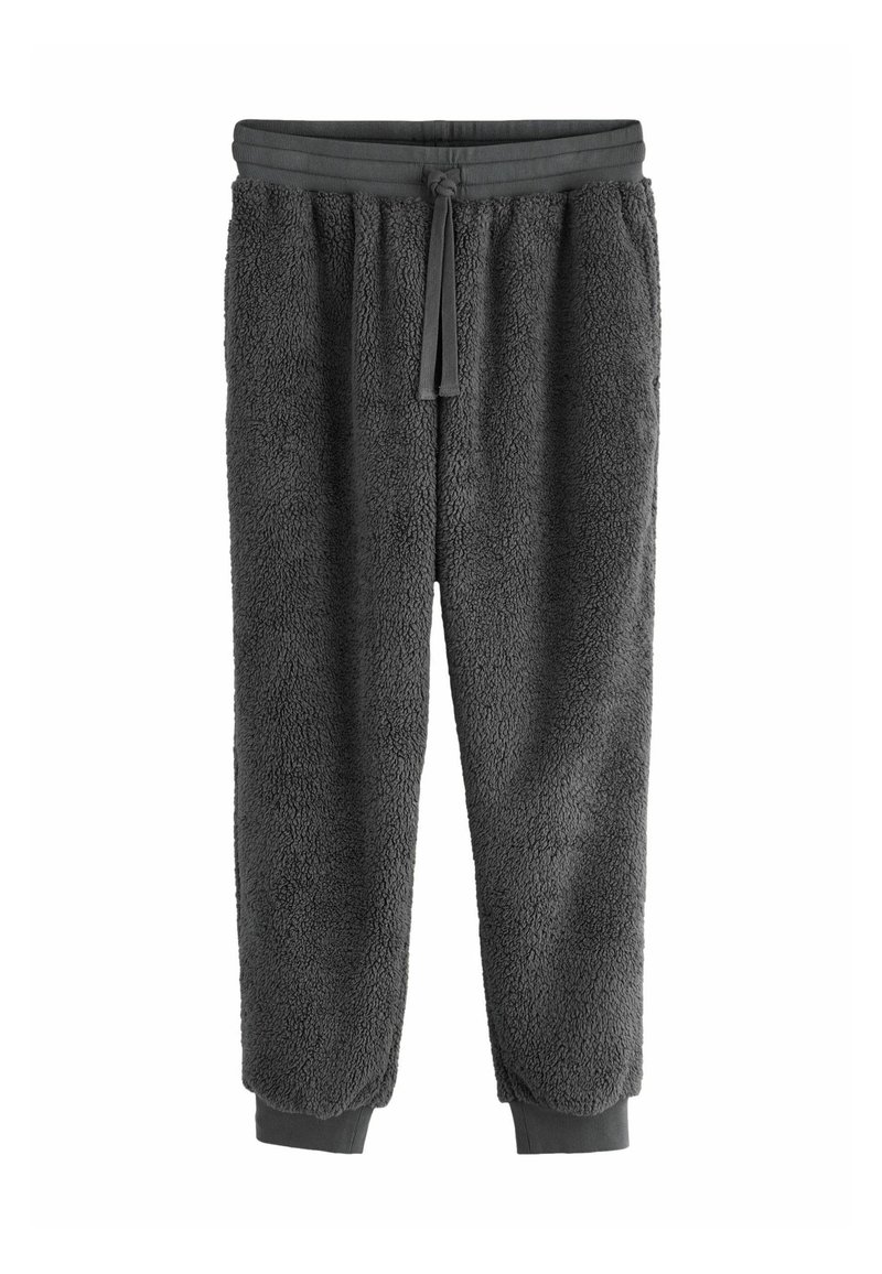 Fleece jogger-housut tummanharmaana, joissa on pehmeä, teksturoitu pinta, joustava vyötärönyöri ja ribattu helmavarsi nilkoissa.